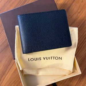 Louis Vuitton men’s calf leather wallet. NEW in box with original dust cover.
